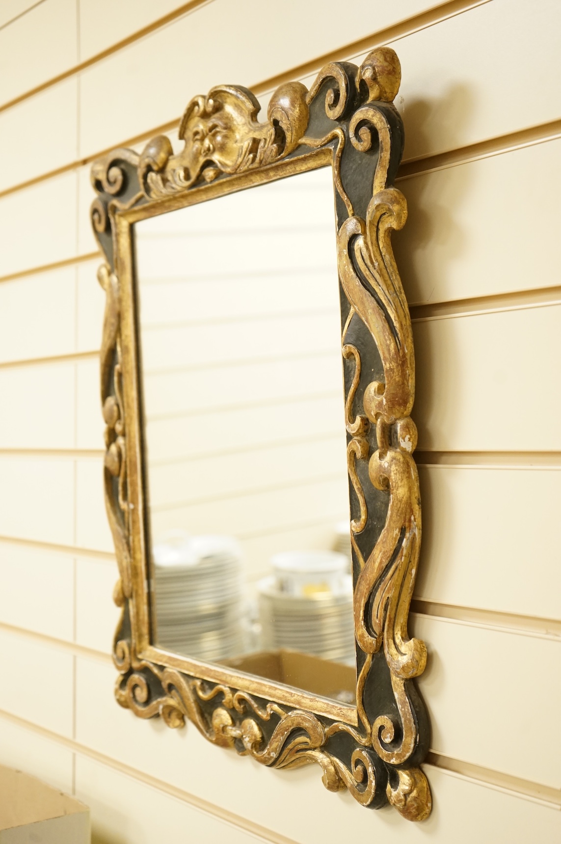 A 19th century parcel-gilt mirror, 53cm high
